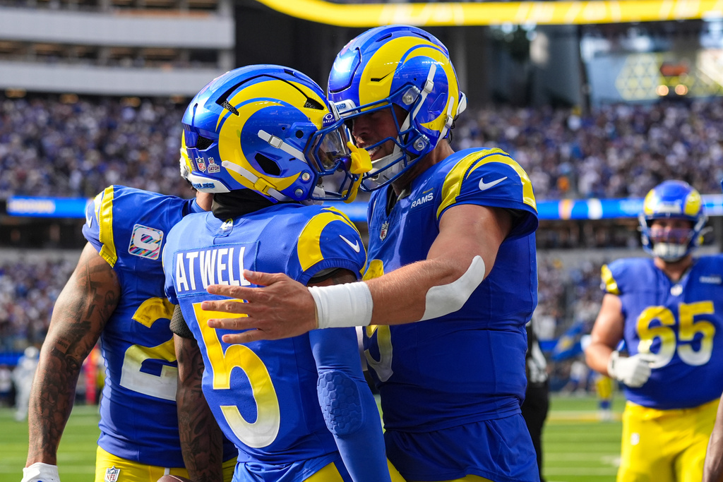 Los Angeles Rams wide receiver Tutu Atwell (5) celebrates his touchdown with quarterback Matthew Stafford (9) against the Indianapolis Colts during the second hall of an NFL football game Sunday, Sept. 28, 2025, in Inglewood, Calif. (AP Photo/Marcio Jose Sanchez)