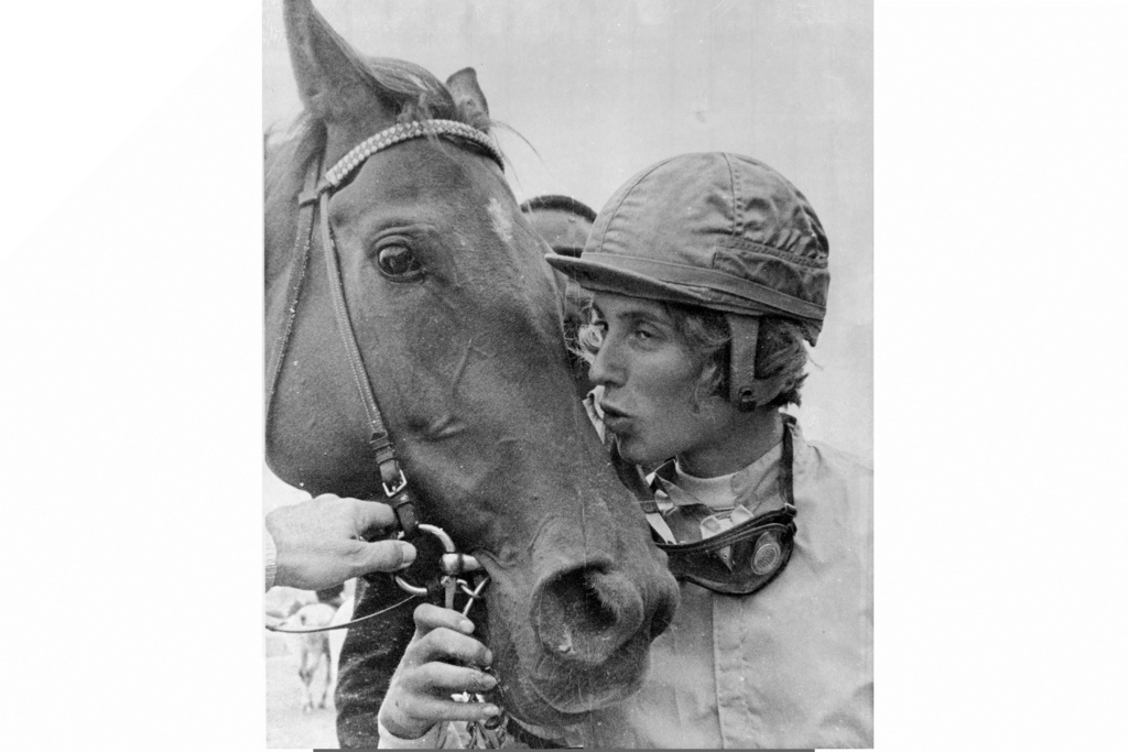 FILE - Diane Crump, apprentice jockey, kisses her mount Tou Ritzi, after winning a Churchill Downs race in Louisville, Kentucky, April 29, 1969. Crump, who in 1969 became the first woman to ride professionally in a horse race and a year later became the first female jockey in the Kentucky Derby, died Thursday, Jan. 1, 2026. She was 77. (AP Photo/Gene Herrick, File)