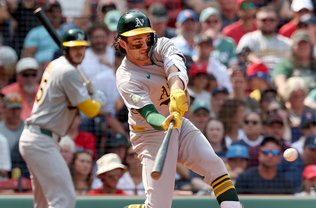 Athletics' Jacob Wilson takes a strike swinging during the fifth inning of a baseball game against the Boston Red Sox, Sunday, Aug. 9, 2026, in Boston. (AP Photo/Mark Stockwell)