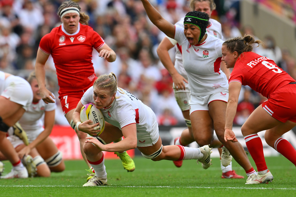 England's Alex Matthews scores a try during the Women's Rugby World Cup final match between England and Canada at the Allianz Stadium, Twickenham in London, Saturday, Sept. 27, 2025.(AP Photo/Anthony Upton)