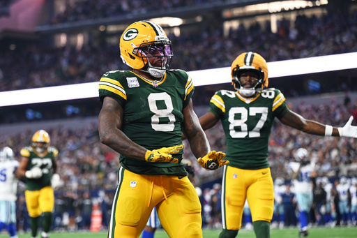 Green Bay Packers running back Josh Jacobs (8) and Romeo Doubs (87) celebrate a touchdown scored by Jacobs in the second half of an NFL football game against the Dallas Cowboys Sunday, Sept. 28, 2025, in Arlington, Texas. (AP Photo/Jessica Tobias) Green Bay Packers running back Josh Jacobs (8) and Romeo Doubs (87) celebrate a touchdown scored by Jacobs in the second half of an NFL football game against the Dallas Cowboys Sunday, Sept. 28, 2025, in Arlington, Texas. (AP Photo/Jessica Tobias)