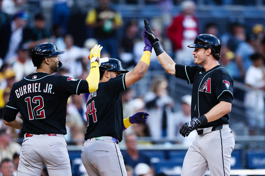 Arizona Diamondbacks' Max Kepler, right, is congratulated by Gabriel Moreno, center, and Lourdes Gurriel Jr., left, after hitting a three-run home run against the San Diego Padres in the third inning of a baseball game Monday, July 6, 2026, in San Diego. (AP Photo/Derrick Tuskan)