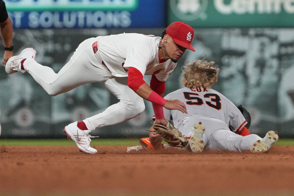 San Francisco Giants' Jonah Cox (53) is caught stealing as St. Louis Cardinals shortstop Masyn Winn places the tag during the sixth inning of a baseball game Monday, Sept. 14, 2026, in St. Louis. (AP Photo/Jeff Roberson)