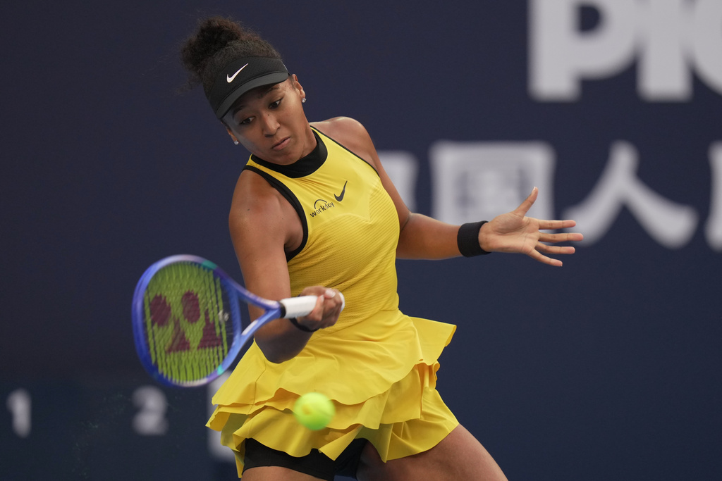 Naomi Osaka, of Japan returns a shot from Aliaksandra Sasnovich, of Russia during the women's singles match for the China Open tennis tournament, at the National Tennis Center, in Beijing, Saturday, Sept. 27, 2025. (AP Photo/Andy Wong)