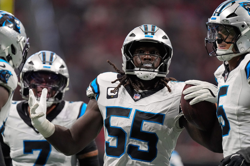 Carolina Panthers linebacker Devin Lloyd (55) celebrates after an interception during an NFL football game against the Atlanta Falcons in Atlanta, Sunday, Sept. 20, 2026. (AP Photo/Mike Stewart)