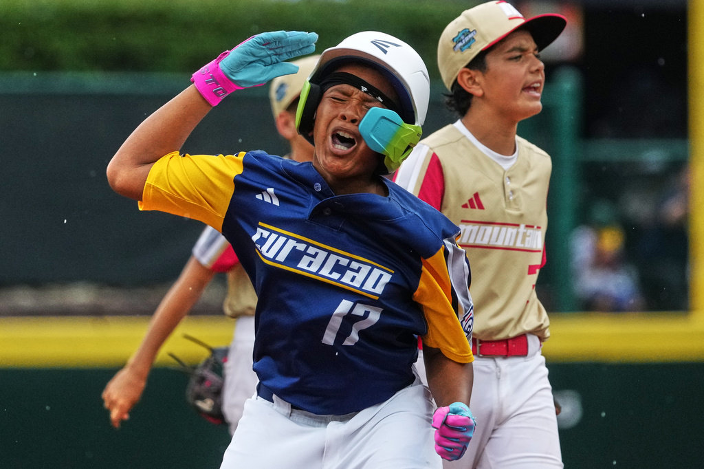Curacao's Junensly De Windt (17) celebrates on second base after driving in three runs with a double off Henderson, Nev.'s pitcher Logan Edwards during the fifth inning of the Little League World Series Championship game in South Williamsport, Pa., Sunday, Aug. 30, 2026. (AP Photo/Gene J. Puskar)
