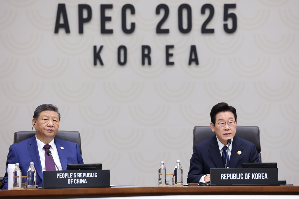 South Korean President Lee Jae Myung, right, speaks next to Chinese President Xi Jinping at the Asia-Pacific Economic Cooperation (APEC) Economic Leaders' Meeting in Gyeongju, South Korea, Saturday, Nov. 1, 2025. (Yonhap via AP)