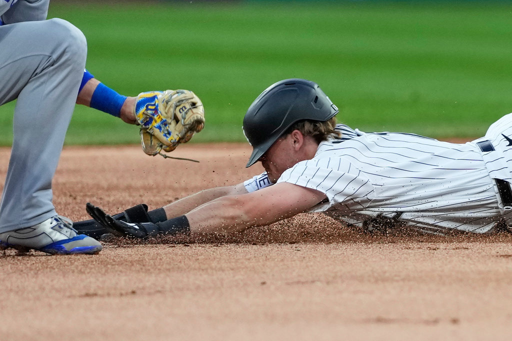 Chicago White Sox's Sam Antonacci, right, steals second as Kansas City Royals shortstop Bobby Witt Jr. applies a late tag during the first inning of a baseball game in Chicago, Tuesday, May 12, 2026. (AP Photo/Nam Y. Huh)
