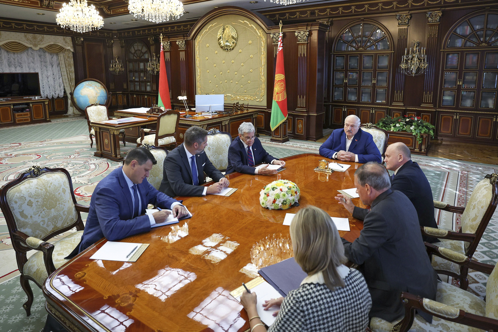 In this photo released by Belarusian presidential press service, Belarusian President Alexander Lukashenko, fourth right, speaks with U.S. Presidential envoy John Coale, third left, during their meeting in Minsk, Belarus, Thursday, Sept. 11, 2025. (Belarusian Presidential Press Service via AP)