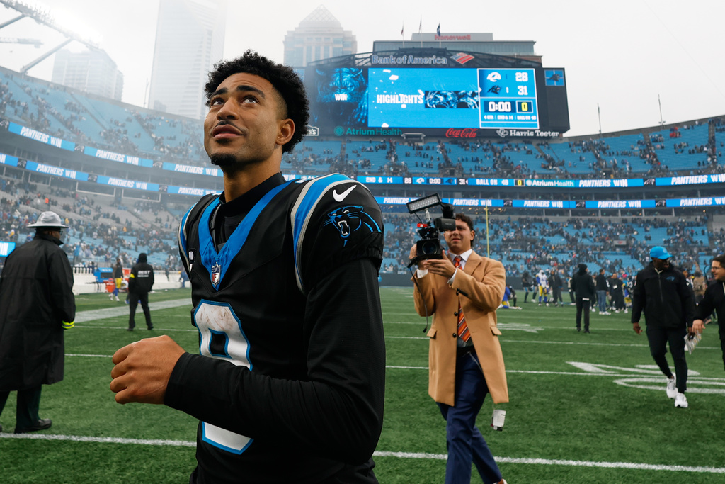 Carolina Panthers quarterback Bryce Young leaves the field after their win in an NFL football game against the Los Angeles Rams, Sunday, Nov. 30, 2025, in Charlotte, N.C. (AP Photo/Rusty Jones)