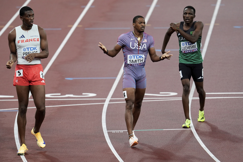 United States' Demarius Smith reacts after a baton change to United States' Bryce Deadmon in a men's 4 X 400 meters relay heat at the World Athletics Championships in Tokyo, Saturday, Sept. 20, 2025. (AP Photo/Abbie Parr)