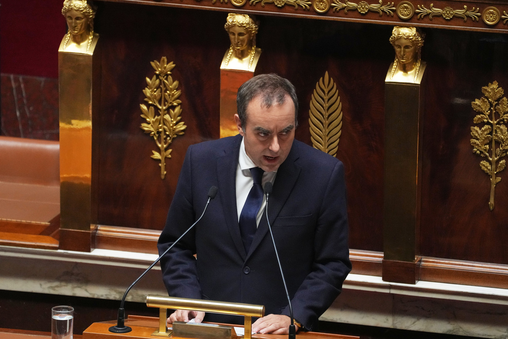 French Prime Minister Sebastien Lecornu delivers his policy speech at the National Assembly, Tuesday, Oct. 14, 2025 in Paris. (AP Photo/Thibault Camus)