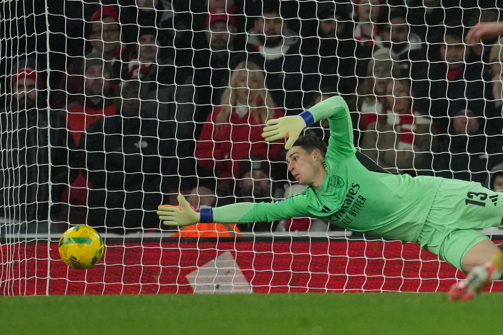 Arsenal's goalkeeper Kepa Arrizabalaga saves during the English Football League Cup quarter-final soccer match between Arsenal and Crystal Palace in London, Tuesday, Dec. 23, 2025. (AP Photo/Kin Cheung)