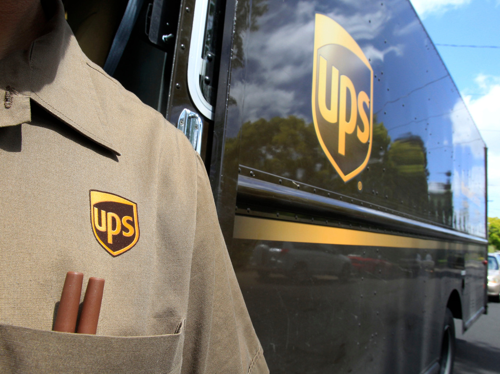 FILE - This April 25, 2011 file photo shows United Parcel Service driver Albert Palafox in Palo Alto, Calif. (AP Photo/Paul Sakuma, File)