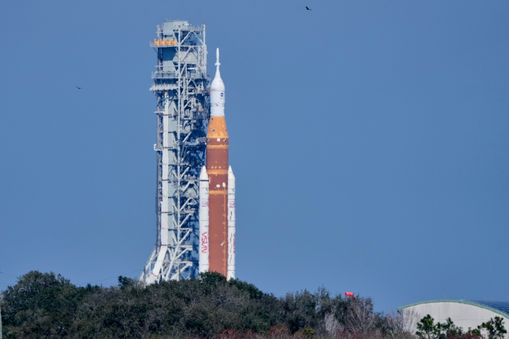 NASA's Artemis II SLS (Space Launch System) moon rocket with the Orion spacecraft slowly rolls back towards the Vehicle Assembly Building at the Kennedy Space Center, Wednesday, Feb. 25, 2026, in Cape Canaveral, Fla. (AP Photo/John Raoux)