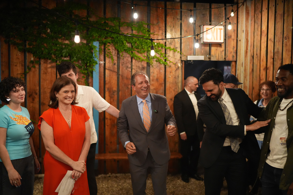 Democratic congressional candidate Brad Lander, center, arrives to greet supporters with his wife Meg Barnette, (second from left, and New York City Mayor Zohran Mamdani, second from right, for an election night watch party Tuesday, June 23, 2026, in New York. (AP Photo/Ryan Murphy)