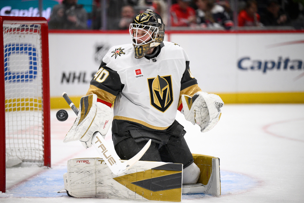 Vegas Golden Knights goaltender Akira Schmid looks for the puck during the first period of an NHL hockey game against the Washington Capitals, Friday, Feb. 27, 2026, in Washington. (AP Photo/Nick Wass)