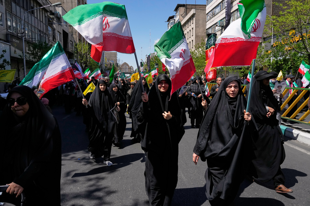 Government supporters gather to mark the 40th day since the death of Supreme Leader Ayatollah Ali Khamenei in Tehran, Iran, Thursday, April 9, 2026. (AP Photo/Vahid Salemi)