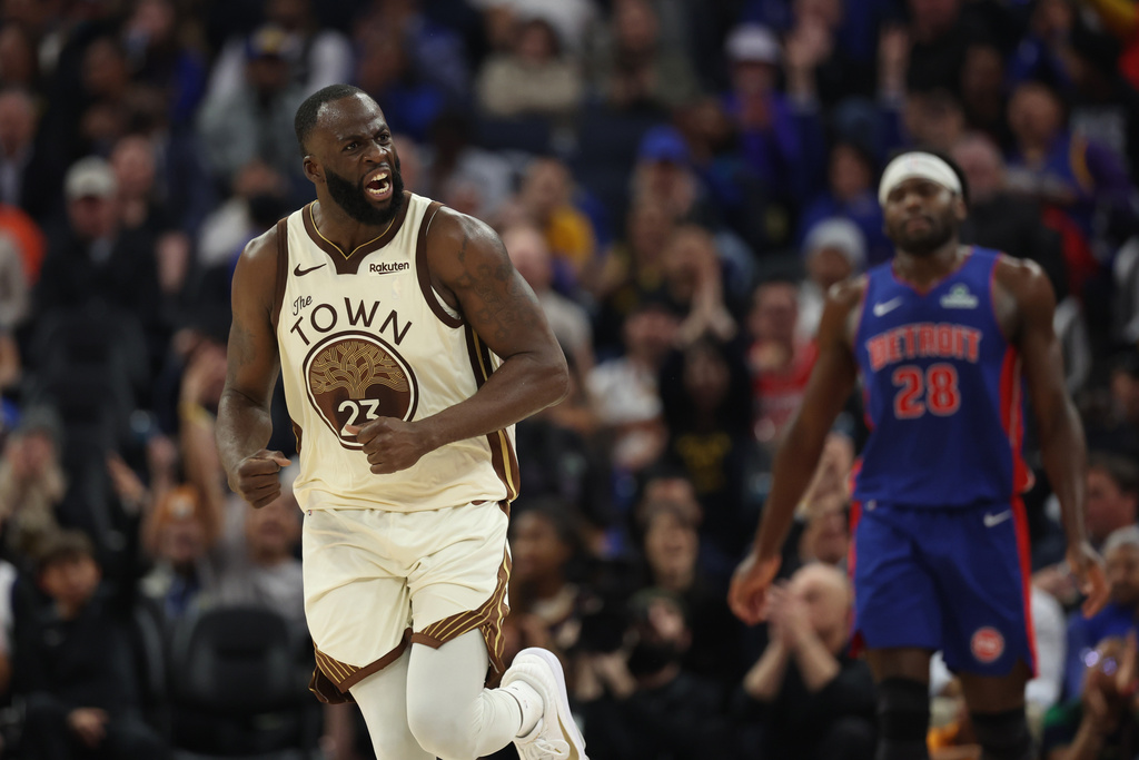 Golden State Warriors forward Draymond Green (23) reacts after scoring during the first half of an NBA basketball game against the Detroit Pistons in San Francisco, Friday, Jan. 30, 2026. (AP Photo/Jed Jacobsohn)