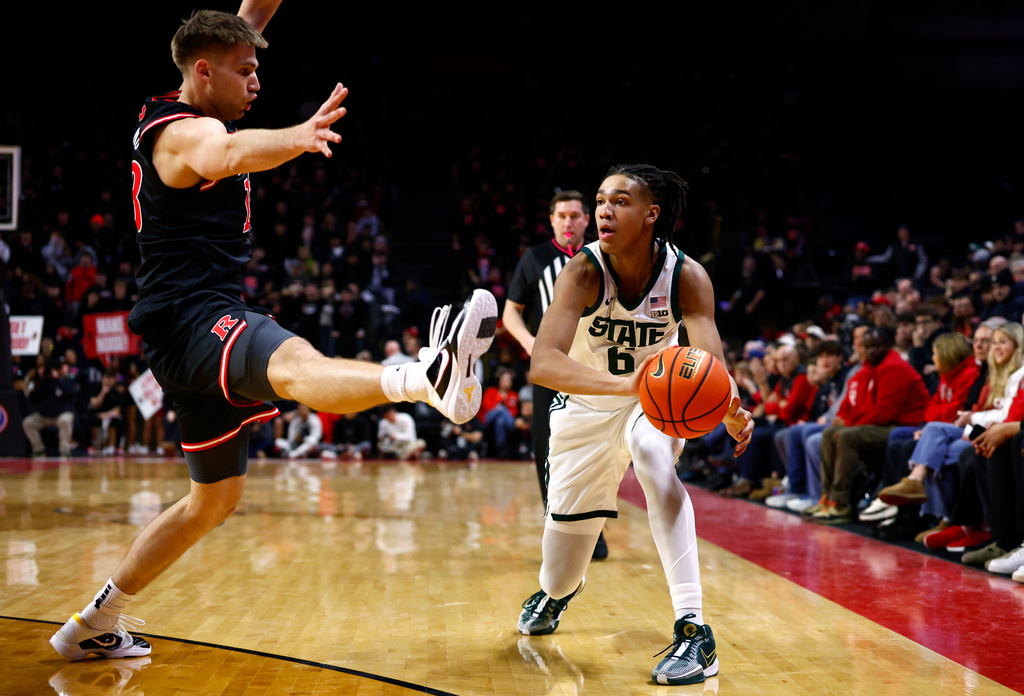 Rutgers guard Harun Zrno (13) defends against Michigan State forward Jordan Scott (6) during the first half of an NCAA college basketball game, Tuesday, Jan. 27, 2026, in Piscataway, N.J. (AP Photo/Noah K. Murray)