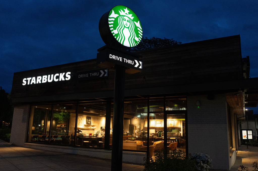 A customer visits a Starbucks location on Monday, April 27, 2026, in Portland, Ore. (AP Photo/Jenny Kane)