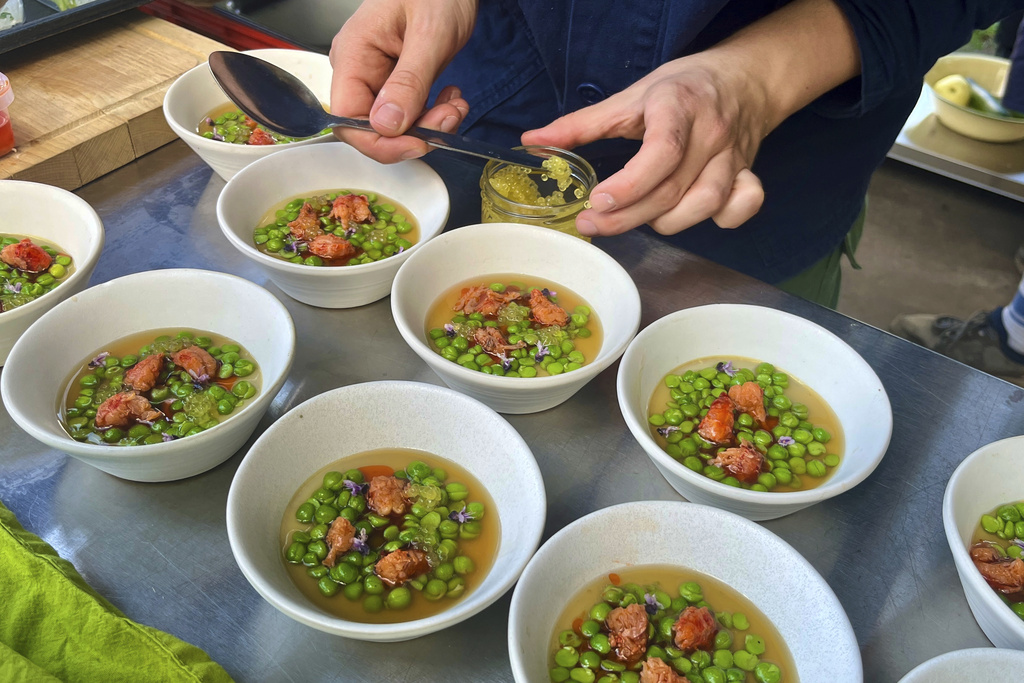 A crayfish dish is prepared in Martin Roetzel's 'The Monk Garden' in Berlin, Germany, Sunday, Aug. 17, 2025. (AP Photo/Fanny Brodersen)