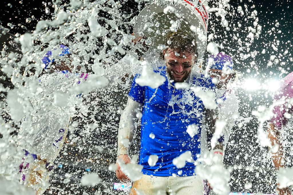 Kansas City Royals' Carter Jensen is doused by teammates after their baseball game against the San Diego Padres, Friday, July 17, 2026, in Kansas City, Mo. (AP Photo/Charlie Riedel)