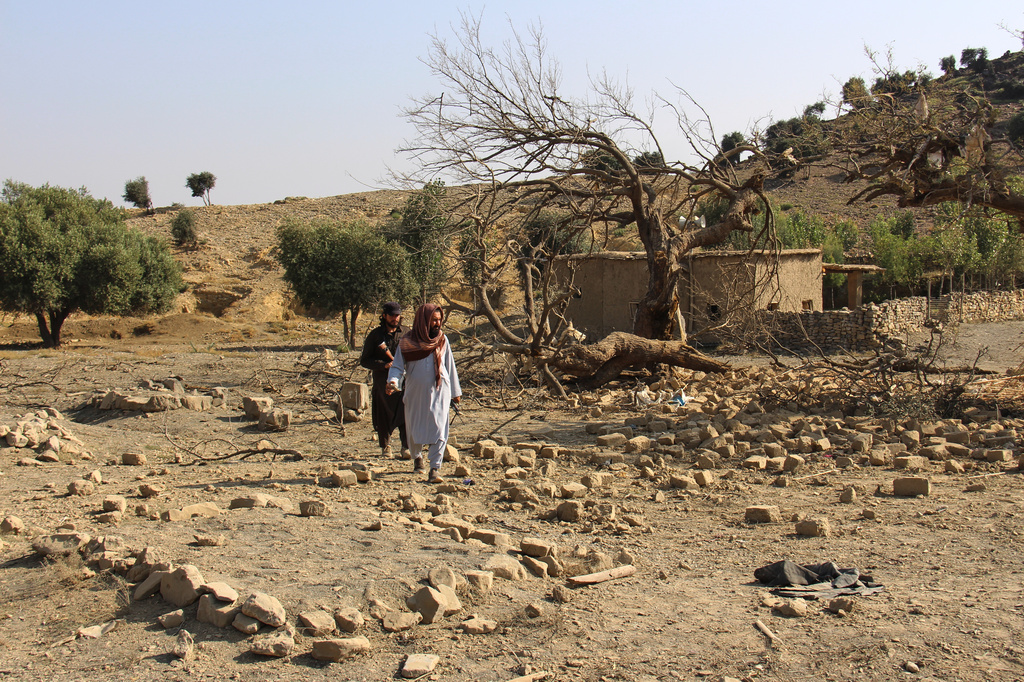 Taliban security officers inspect the scene of what Taliban officials said were Pakistani airstrikes in Khost province, Afghanistan, Thursday, Sept. 24, 2026. (AP Photo/Saifullah Zahir)