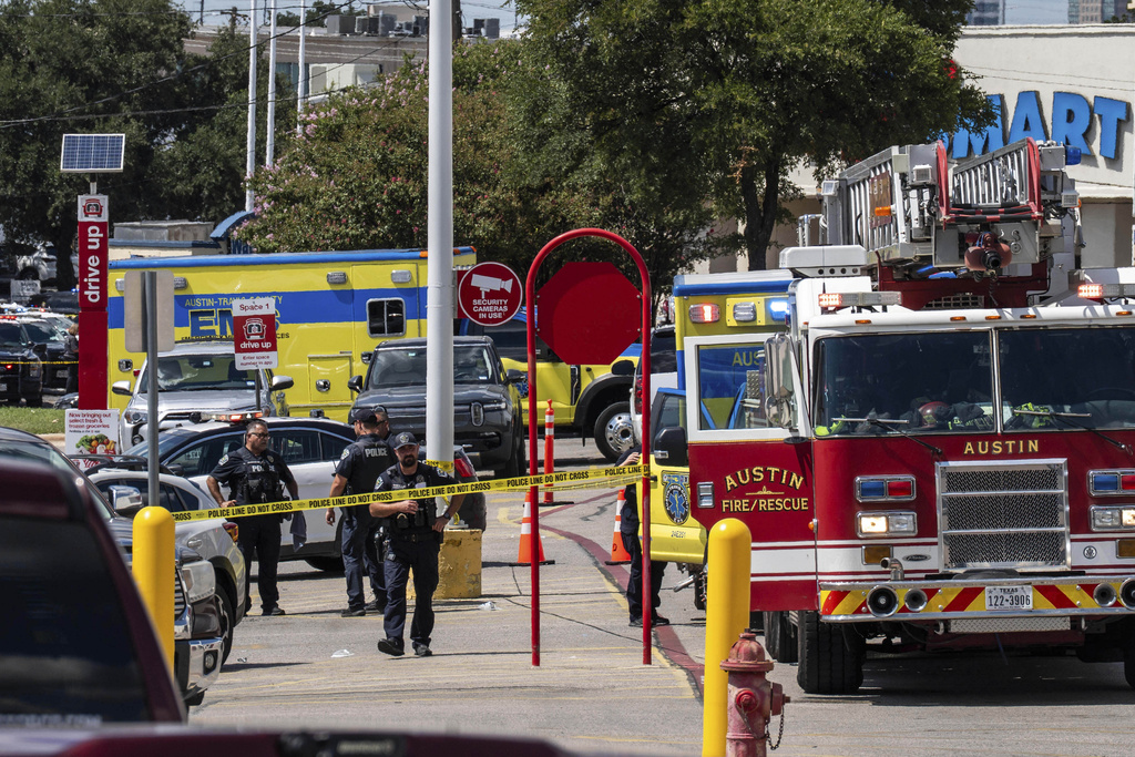 Law enforcement investigates a shooting at Target off Research Boulevard, near Ohlen Road in Austin, Texas, Monday, Aug. 11, 2025. (Mikala Compton/Austin American-Statesman via AP)
