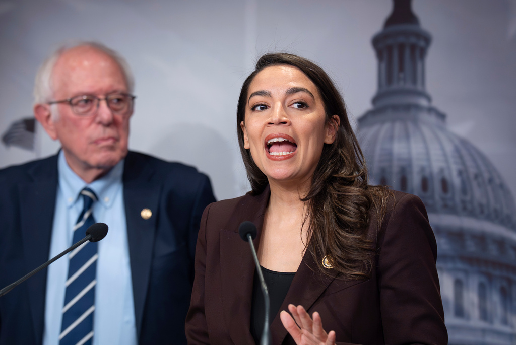 Sen. Bernie Sanders, I-Vt., left, and Rep. Alexandria Ocasio Cortez, D-N.Y., hold a news conference on the Artificial Intelligence Data Center Moratorium Act, at the Capitol in Washington, Wednesday, March 25, 2026. (AP Photo/J. Scott Applewhite)