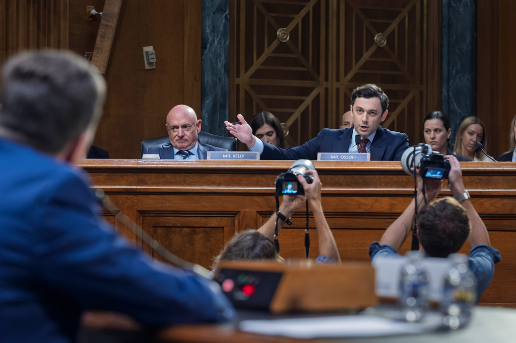 Sen. Jon Ossoff, D-Ga., joined at left by Sen. Mark Kelly, D-Ariz., questions Jay Clayton, President Donald Trump's pick to head the nation's intelligence agencies, as he appears for his confirmation hearing before the Senate Intelligence Committee, at the Capitol in Washington, Wednesday, July 15, 2026. (AP Photo/J. Scott Applewhite)