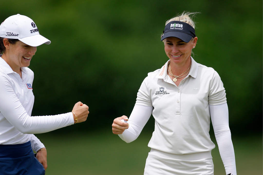 Ryann O'Toole, right, and Albane Valenzuela, left, celebrate on the 16th green during the first round of the Dow Championship LPGA golf tournament, Thursday, June 11, 2026, at Midland Country Club in Midland, Mich. (AP Photo/Al Goldis)