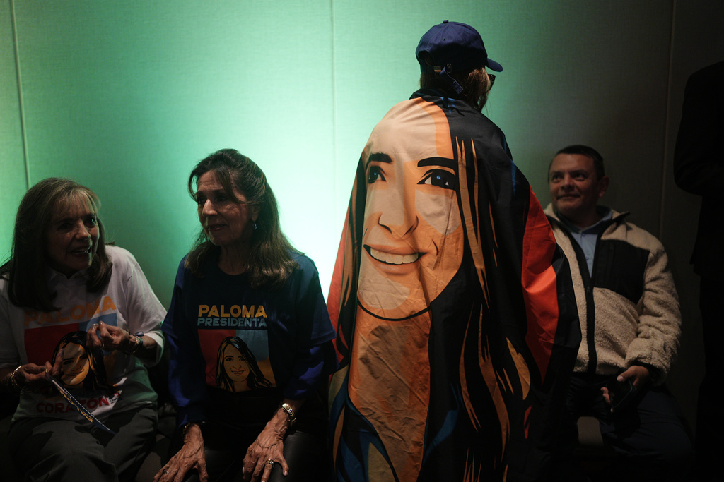 Supporters of Sen. Paloma Valencia of the Democratic Center gather after she won the nomination of an opposition coalition for the upcoming presidential election in Bogota, Colombia, Sunday, March 8, 2026. (AP Photo/Ivan Valencia)