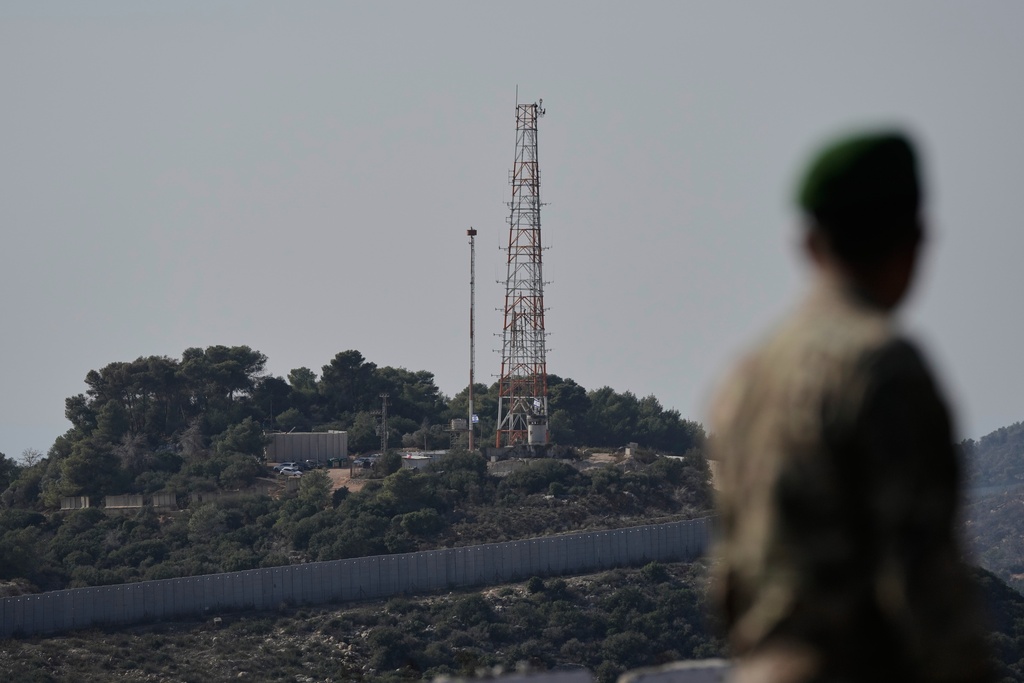 FILE - A Lebanese army soldier looks at the Israeli military post of Hanita from the Alma al-Shaab border village with Israel, south Lebanon, southern Lebanon, Nov. 28, 2025. (AP Photo/Bilal Hussein, File)