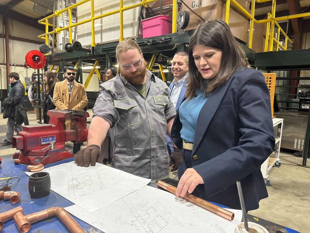 U.S. Rep. Haley Stevens, a Democrat running for U.S. Senate in Michigan, tours a plumbing and pipefitting apprenticeship program workshop at UA Local 85 in Saginaw, Mich., Friday, Jan. 30, 2026. (AP Photo/Isabella Volmert)