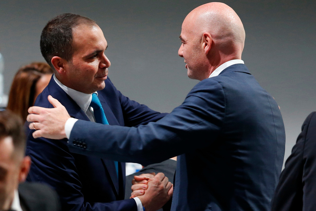 FILE - Newly elected FIFA President Gianni Infantino, of Switzerland, right, is congratulated by fellow candidate Prince Ali Al-Hussein, of Jordan, left, after the second election round during the extraordinary FIFA congress in Zurich, Switzerland, Feb. 26, 2016. (AP Photo/Michael Probst, File)
