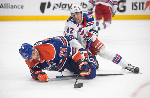 New York Rangers' Noah Laba (42) and Edmonton Oilers' Darnell Nurse (25) become entangled during third-period NHL hockey game action in Edmonton, Alberta, Thursday, Oct. 30, 2025. (Jason Franson/The Canadian Press via AP) New York Rangers' Noah Laba (42) and Edmonton Oilers' Darnell Nurse (25) become entangled during third-period NHL hockey game action in Edmonton, Alberta, Thursday, Oct. 30, 2025. (Jason Franson/The Canadian Press via AP)