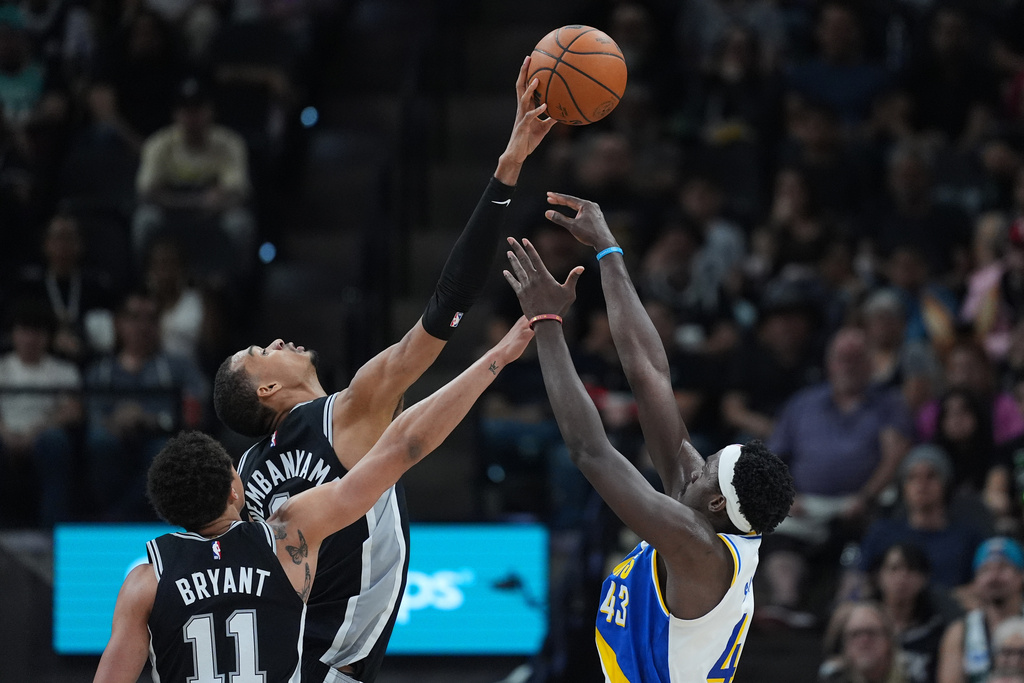 Indiana Pacers forward Pascal Siakam (43) is blocked by San Antonio Spurs forward Victor Wembanyama, center, during the first half of an NBA basketball game in San Antonio, Saturday, March 21,2026. (AP Photo/Eric Gay)
