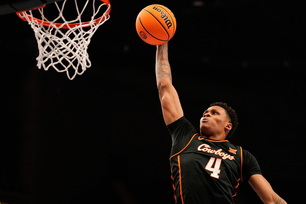 Oklahoma State forward Christian Coleman shoots during the first half of an NCAA college basketball game against Colorado at the Big 12 Conference tournament Tuesday, March 10, 2026, in Kansas City, Mo. (AP Photo/Charlie Riedel)
