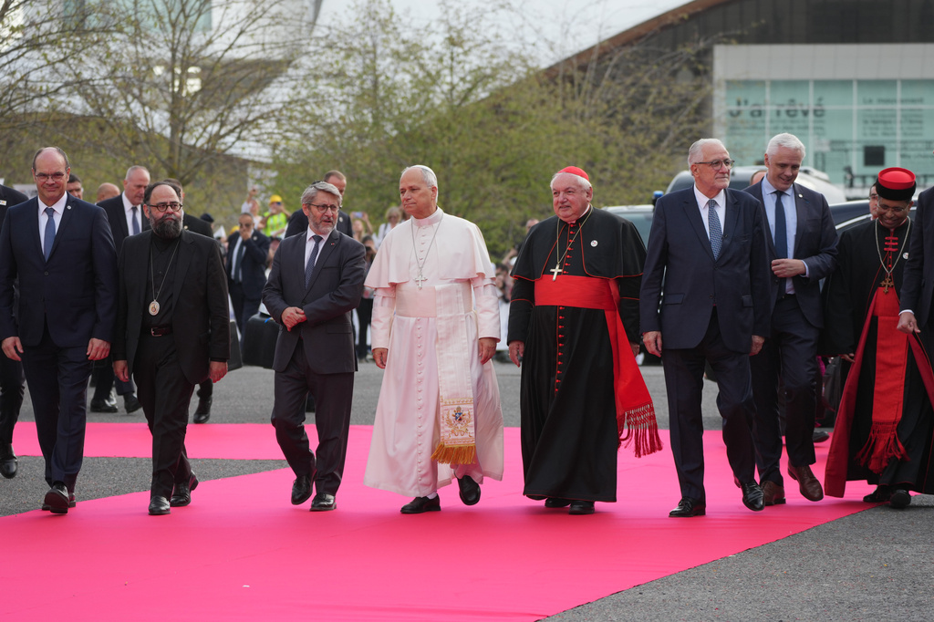 Pope Leo XIV, center, arrives, with, from left, Christian Krieger, president of the Protestant Federation of France, Bishop Dimitrios (Ploumis), the Greek Orthodox Metropolitan of France, Haïm Korsia, Chief Rabbi of France, President of the French Bishops' Conference, Cardinal Jean-Marc Aveline, Chems-eddine Hafiz, rector of the Grand Mosque of Paris, Anthony Boussemart, representing French Buddhists, and Cardinal George Jacob Koovakad, prefect of the Dicastery for Interreligious Dialogue, to attend an interreligious meeting at the Robert Schuman Convention Centre, Monday, Sept. 28, 2026, in Metz, France. (AP Photo/Gregorio Borgia) ADDITION: Add names of persons in the photo