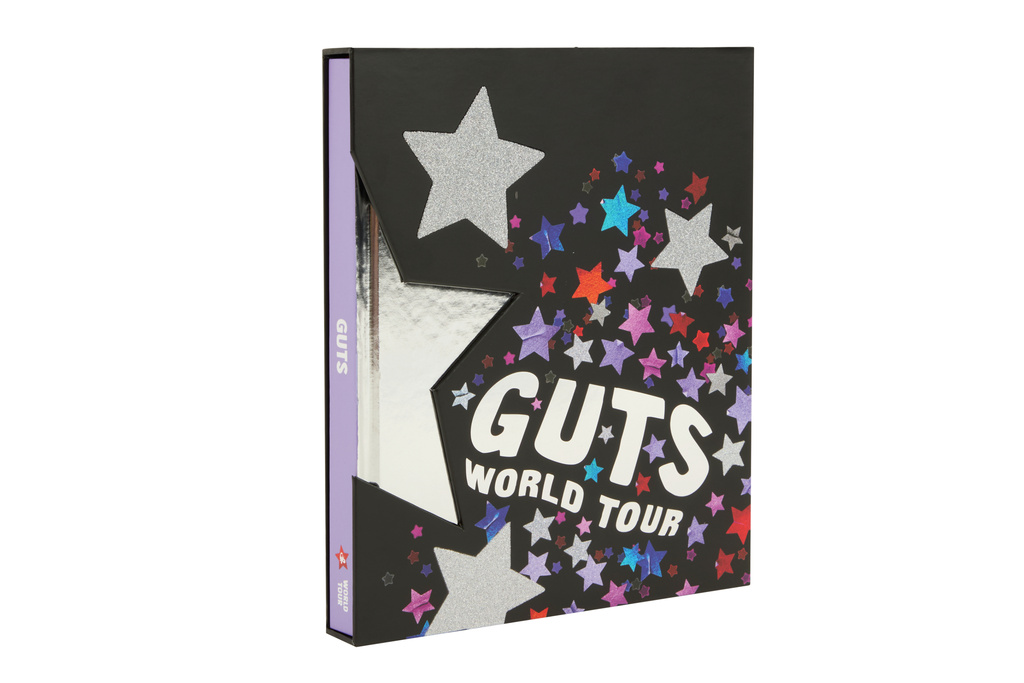 This product image released by Universal Music shows Olivia Rodrigo's "GUTS World Tour Book." (Universal Music via AP)