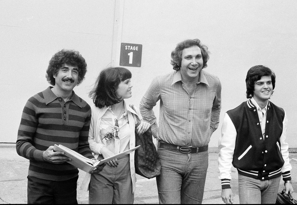 FILE - Sid Krofft, left, and his brother Marty Krofft, second from right, pose with Marie Osmond and Donnie Osmond on the set of "The Donnie and Marie Show" in Los Angeles on Oct. 6, 1976. (AP Photo/David F. Smith, File)