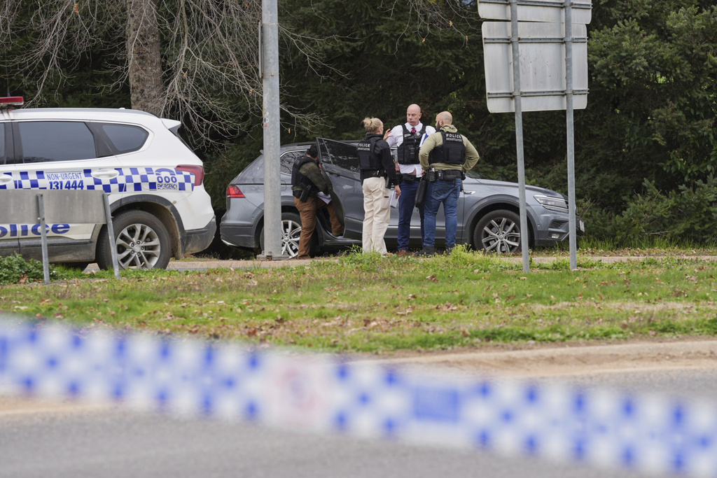 Police wait near the scene of a shooting in the high country of Porepunkah in the state of Victoria, Australia, Tuesday, Aug. 26, 2025.(Simon Dallinger/AAP Image via AP)