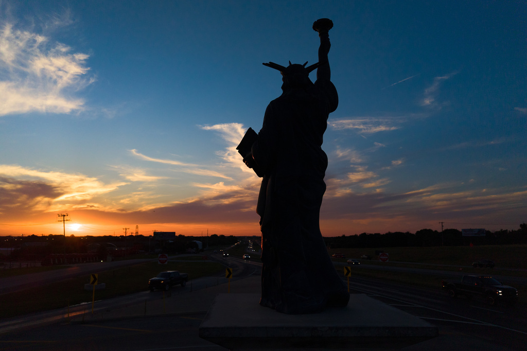 A replica of the Statue of Liberty stands over U.S. Highway 80 at the entrance of Forney, Texas, Friday, May 29, 2026. (AP Photo/Julio Cortez)