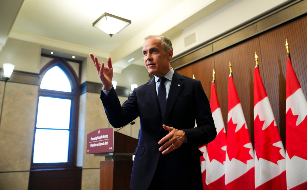 Prime Minister Mark Carney leaves after making an announcement on Parliament Hill in Ottawa on Thursday, May 14, 2026. (Sean Kilpatrick/The Canadian Press via AP)