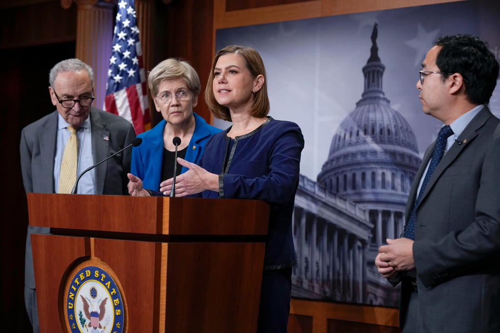 From left, Senate Minority Leader Chuck Schumer, D-N.Y., Sen. Elizabeth Warren, D-Mass., the ranking member of the Senate Banking Committee, Sen. Elissa Slotkin, D-Mich., a member of the Armed Service Committee, and Sen. Andy Kim, D-N.J., ranking member of the Subcommittee on National Security and International Trade and Finance, speak to reporters ahead of the meeting between China's President Xi Jinping and President Donald Trump to demand stronger controls to stop the flow of American chips and artificial intelligence technology into China, at the Capitol in Washington, Wednesday, Sept. 23, 2026. (AP Photo/J. Scott Applewhite)