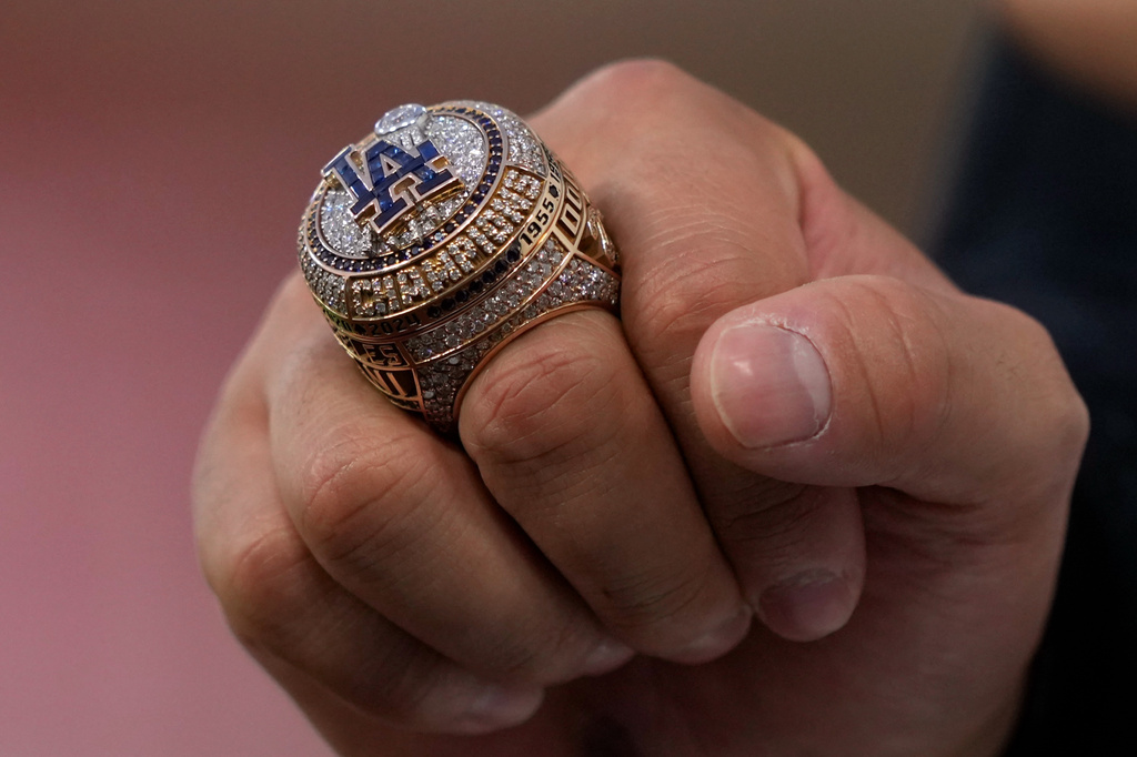 Los Angeles Dodgers' Shohei Ohtani hold his ring during a World Series ring ceremony prior to a baseball game against the Arizona Diamondbacks, Friday, March 27, 2026, in Los Angeles. (AP Photo/Mark J. Terrill)