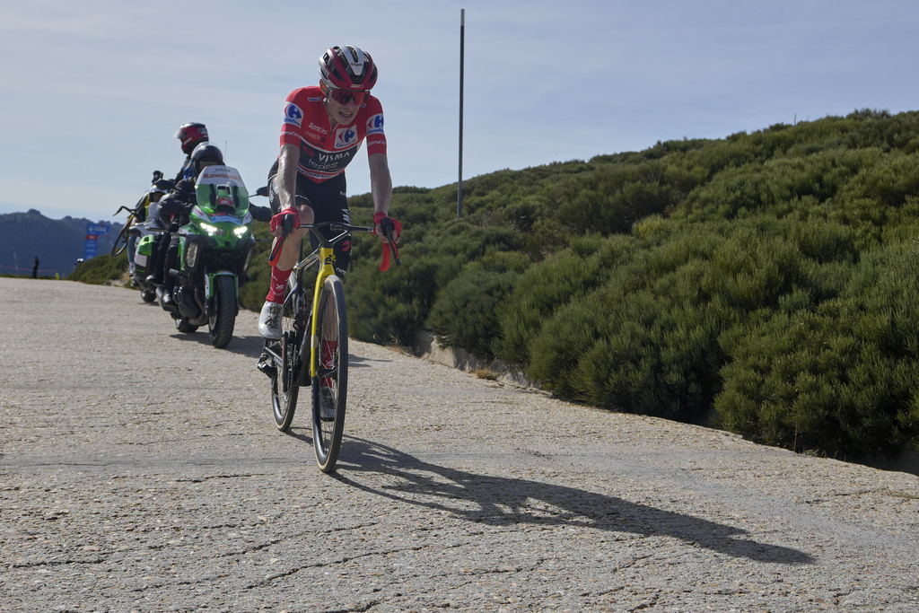 Danish cyclist Jonas Vingegaard completes the final meters before winning the 20th stage and his first overall victory in the Spanish cycling race La Vuelta, from Robledo de Chavela to Bola del Mundo, in Puerto de Navacerrada, Spain, on Saturday, September 13, 2025. (AP Photo/Manu Fernández)