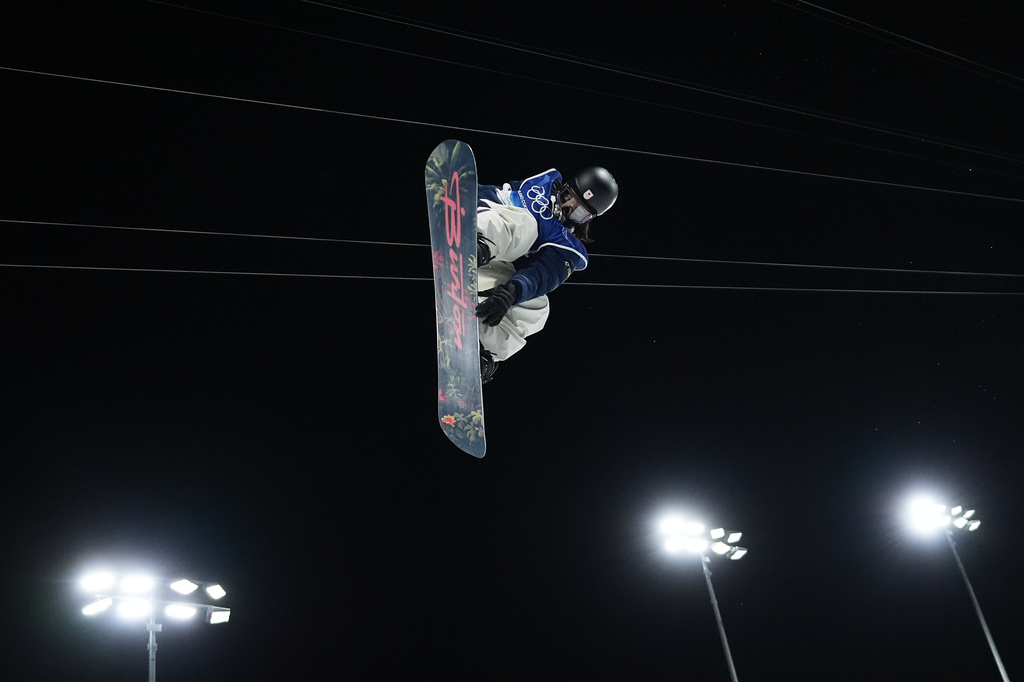 Japan's Ayumu Hirano practices before the men's snowboarding halfpipe finals at the 2026 Winter Olympics, in Livigno, Italy, Friday, Feb. 13, 2026. (AP Photo/Lindsey Wasson)