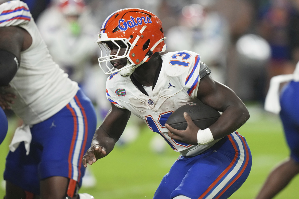 Florida running back Jadan Baugh runs with the ball during the first half of an NCAA college football game against Miami, Saturday, Sept. 20, 2025, in Miami Gardens, Fla. (AP Photo/Lynne Sladky)